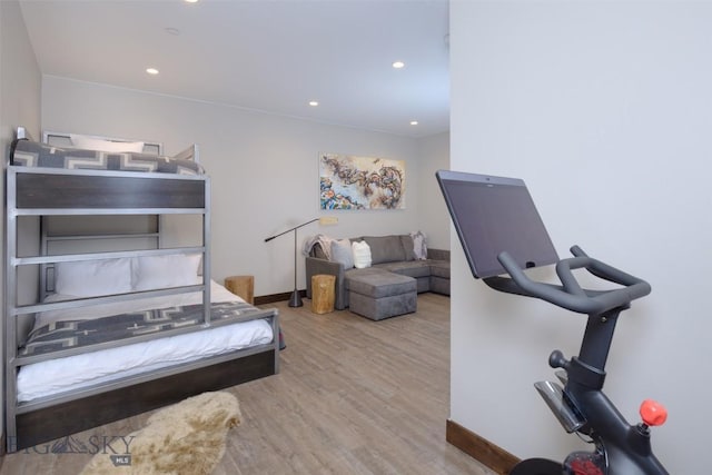 bedroom featuring recessed lighting, wood finished floors, and baseboards