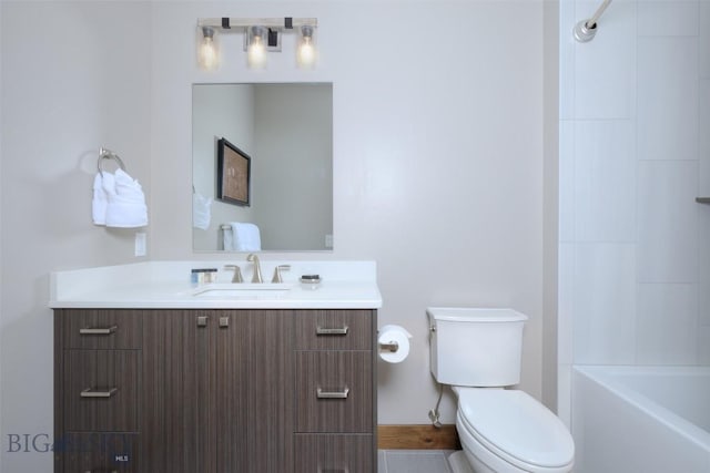 bathroom with toilet and vanity