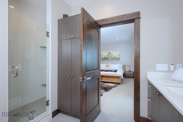 ensuite bathroom featuring vanity, a stall shower, and ensuite bathroom