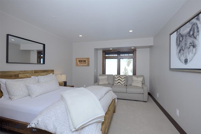 bedroom with recessed lighting, baseboards, and light carpet