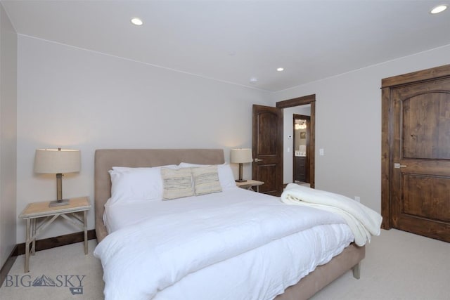 carpeted bedroom featuring recessed lighting and baseboards