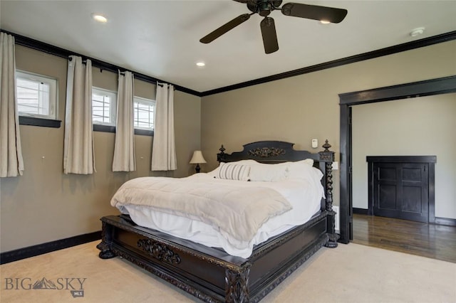 bedroom with wood finished floors, a ceiling fan, baseboards, recessed lighting, and ornamental molding