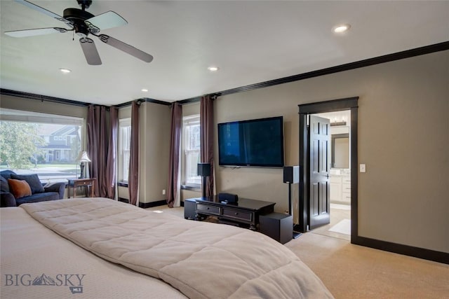 bedroom with ornamental molding, multiple windows, baseboards, and light carpet