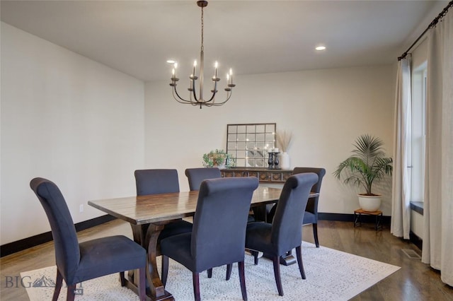 dining room featuring recessed lighting, baseboards, an inviting chandelier, and dark wood-style flooring