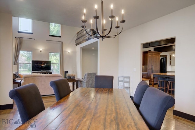 dining room featuring a notable chandelier and wood finished floors