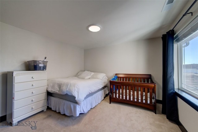 carpeted bedroom with baseboards