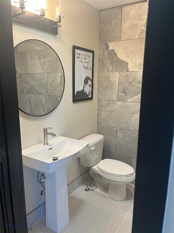 bathroom with tile patterned floors and toilet