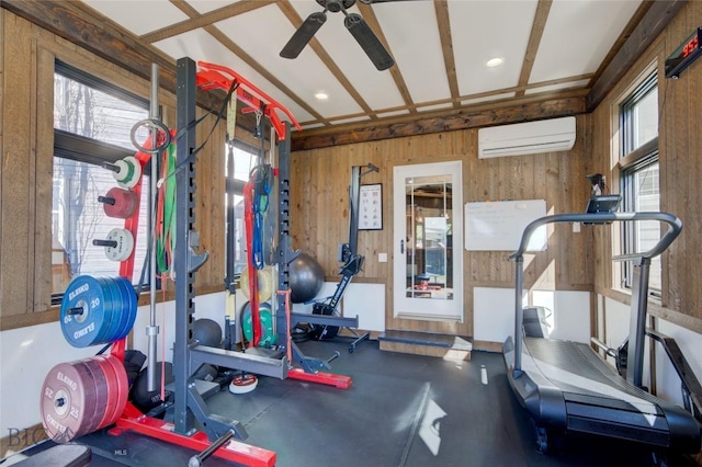 workout room featuring wood walls, a wall mounted AC, and ceiling fan