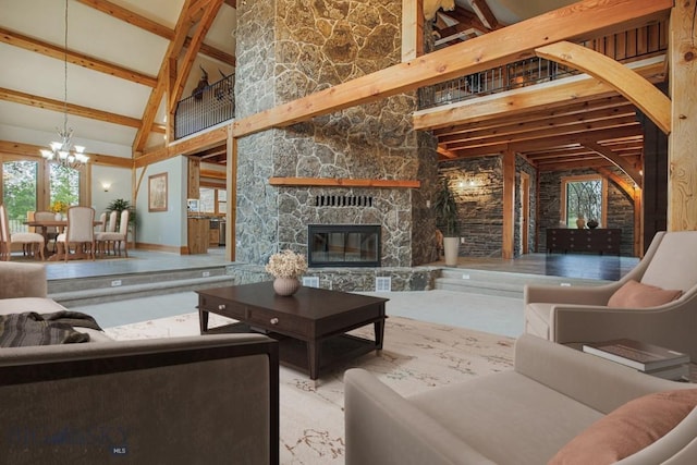 living area with a stone fireplace, beam ceiling, plenty of natural light, and high vaulted ceiling