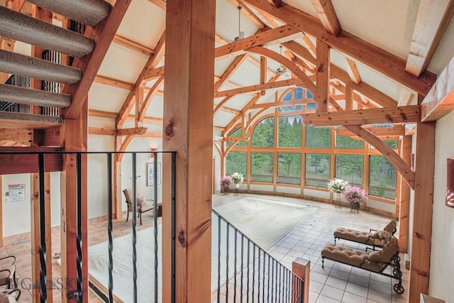 unfurnished sunroom with lofted ceiling with beams