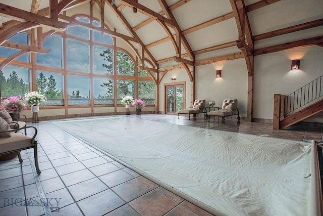 interior space with vaulted ceiling with beams