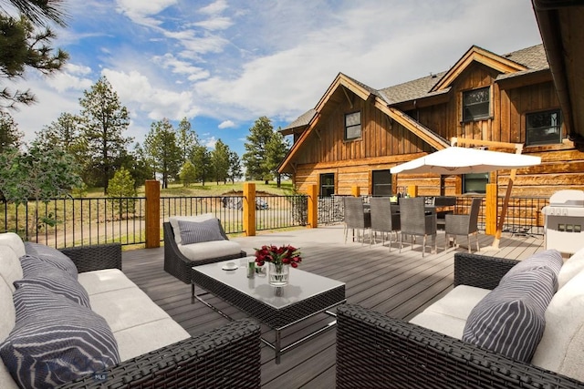 wooden deck featuring an outdoor living space