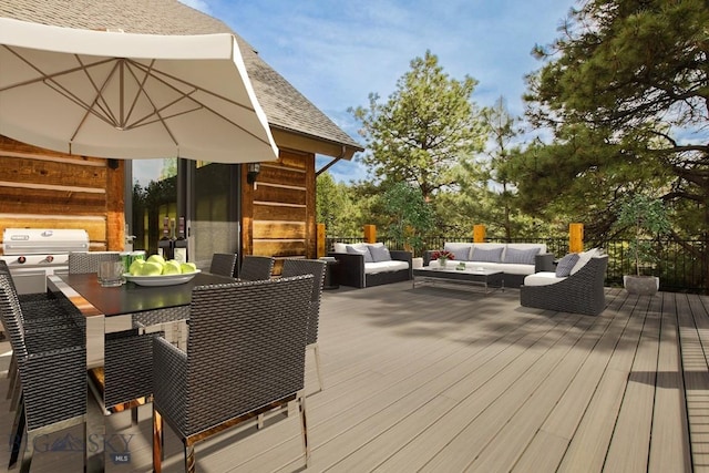 wooden terrace featuring area for grilling, outdoor dining space, and outdoor lounge area