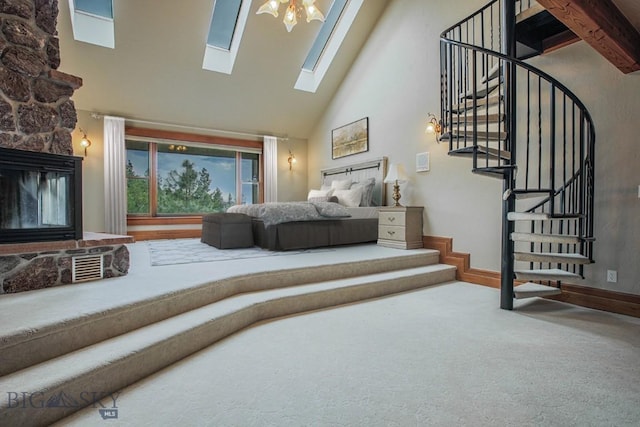 bedroom featuring a stone fireplace, carpet flooring, baseboards, and high vaulted ceiling