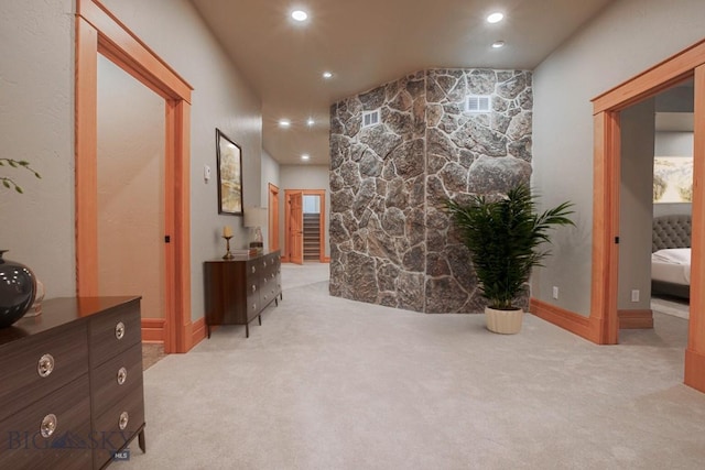 hallway with recessed lighting, visible vents, and carpet