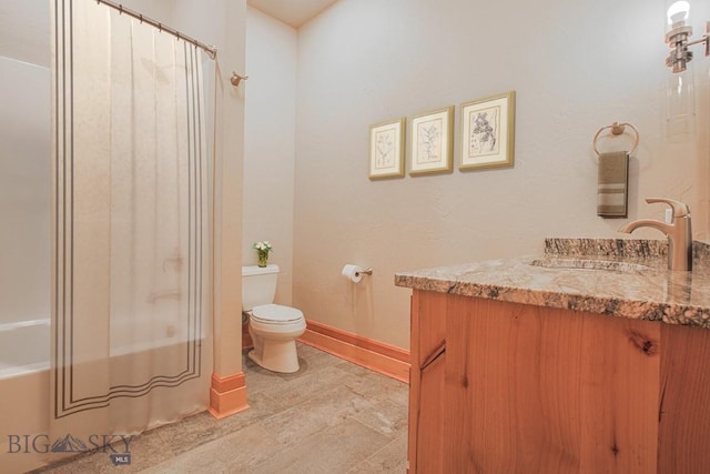 full bath with baseboards, toilet, vanity, and shower / bath combination with curtain