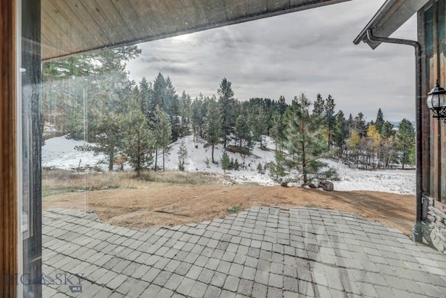 view of snow covered patio