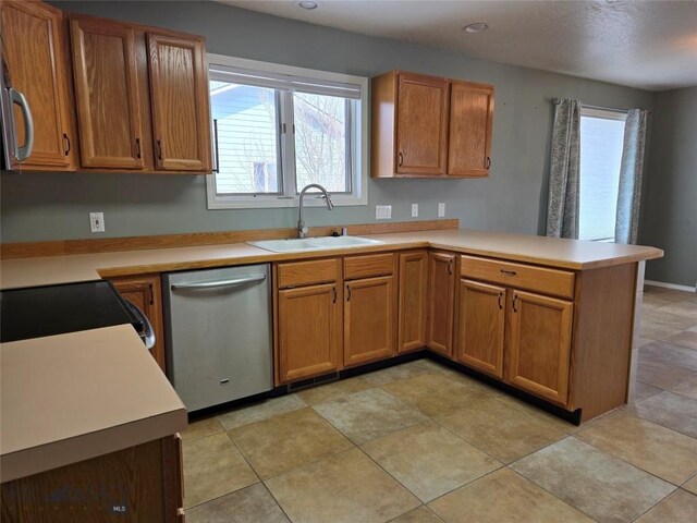 3004 Green Cir, Butte, MT 59701 - kitchen featuring dishwasher, a sink, a peninsula, black electric range oven, and light countertops