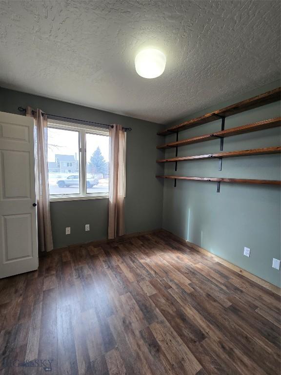 3004 Green Cir, Butte, MT 59701 - unfurnished room with a textured ceiling and wood finished floors