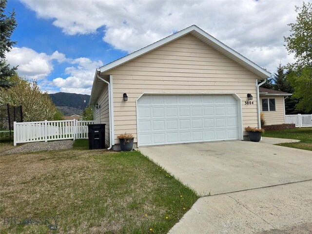 3004 Green Cir, Butte, MT 59701 - view of side of property with a garage and a mountain view
