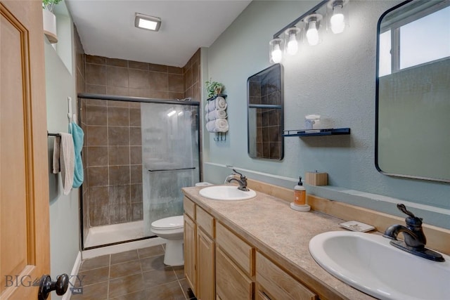 full bathroom with a shower stall, toilet, and a sink