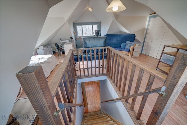 stairway with wood finished floors