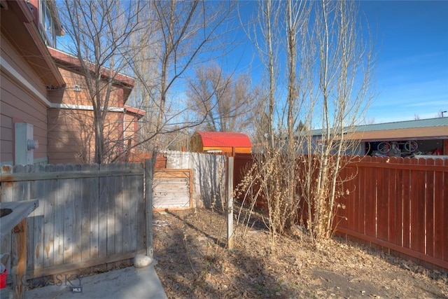 view of yard with a fenced backyard