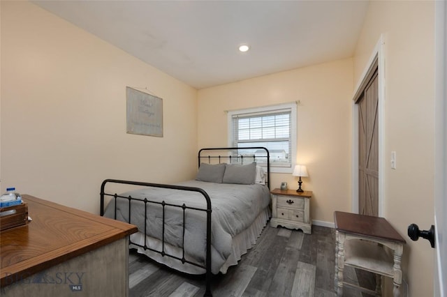 bedroom featuring dark wood-type flooring, recessed lighting, and baseboards