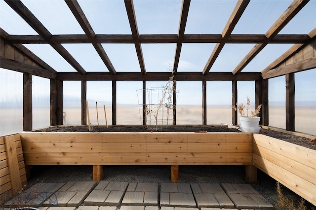 interior space featuring a water view and vaulted ceiling