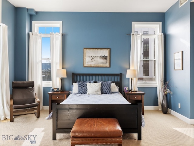 bedroom featuring carpet and baseboards