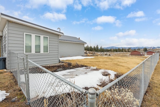 exterior space featuring fence private yard and a mountain view