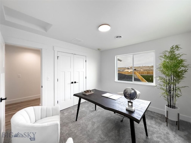 home office featuring baseboards and visible vents