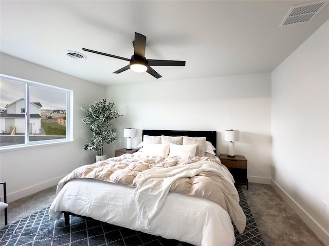 bedroom with visible vents, carpet flooring, and baseboards