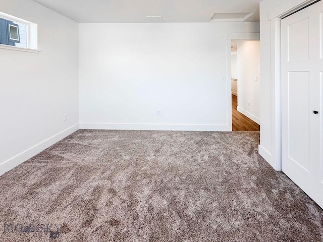 unfurnished bedroom featuring carpet, baseboards, and a closet