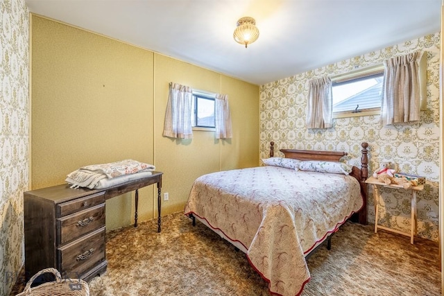 bedroom featuring wallpapered walls and carpet flooring