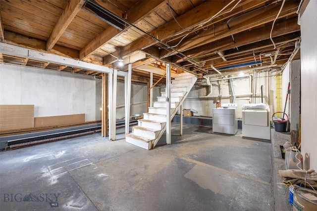 unfinished basement with independent washer and dryer and stairs