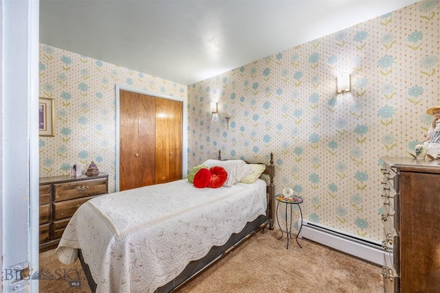 bedroom with wallpapered walls, carpet flooring, and a baseboard radiator