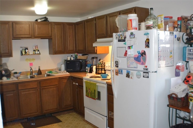 kitchen with white appliances, brown cabinetry, a sink, light countertops, and under cabinet range hood