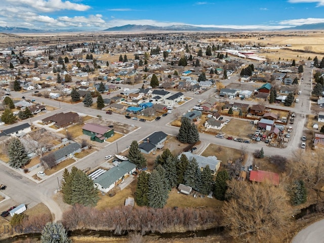 birds eye view of property featuring a mountain view and a residential view