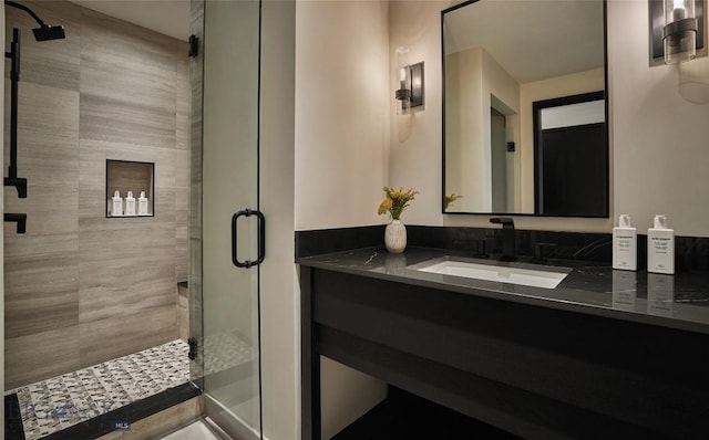 bathroom featuring vanity and a stall shower