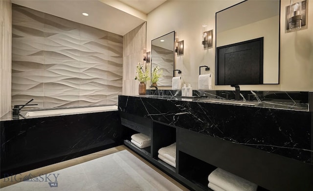 bathroom with recessed lighting and double vanity