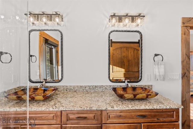 bathroom featuring double vanity and a sink