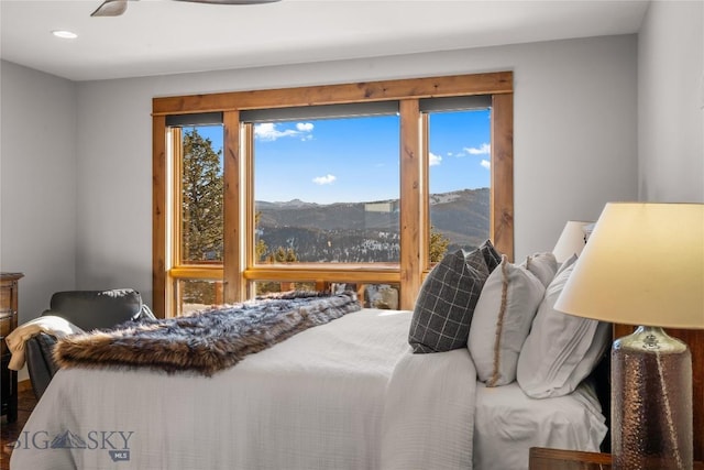 bedroom featuring a mountain view