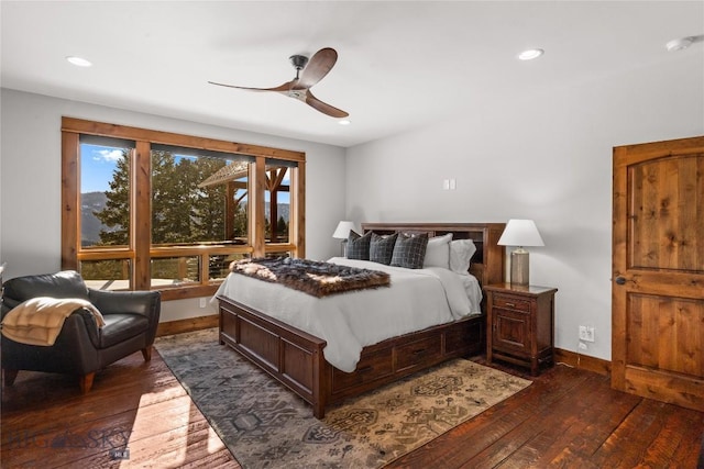 bedroom featuring recessed lighting, dark wood-style floors, and baseboards