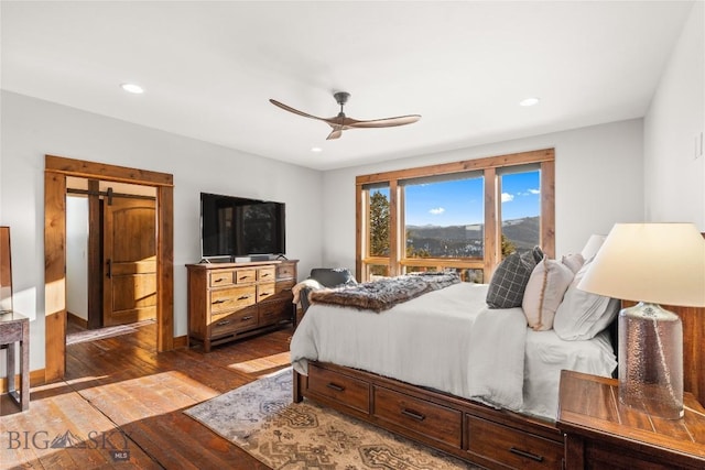 bedroom with recessed lighting, baseboards, hardwood / wood-style floors, and a ceiling fan