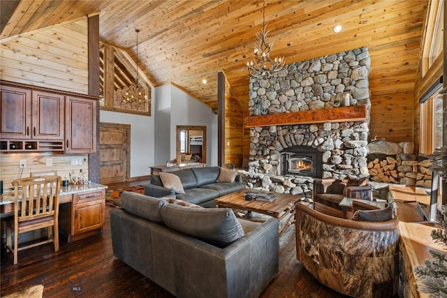 living room with wooden walls, wooden ceiling, an inviting chandelier, high vaulted ceiling, and dark wood-style flooring