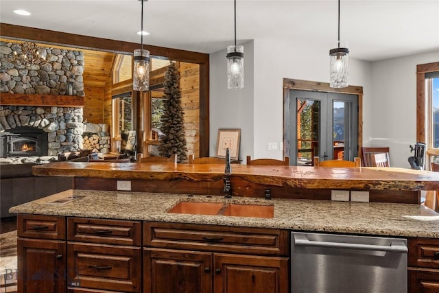 bar featuring decorative light fixtures, a sink, french doors, and stainless steel dishwasher