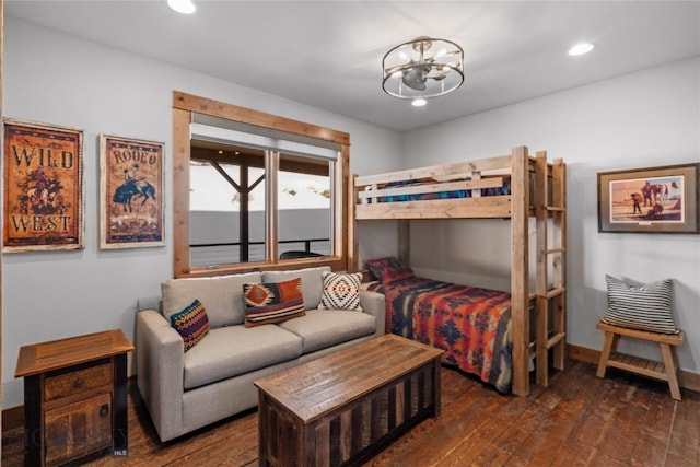 bedroom with a notable chandelier, recessed lighting, baseboards, and wood-type flooring