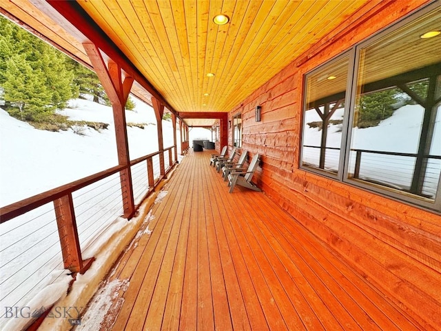 view of snow covered deck