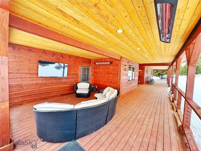 wooden deck with an outdoor living space